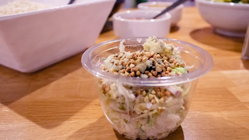 Apple, sprout, sour cream and blue cheese 'slaw with toasted buckwheat