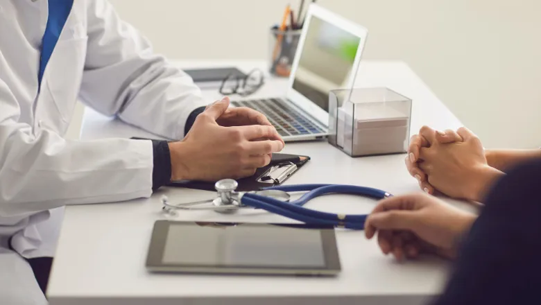 Patient sat with a doctor