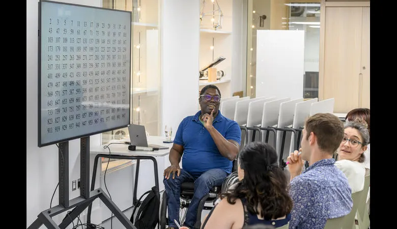 Dr Lassina Dembélé lecturing to a group of students